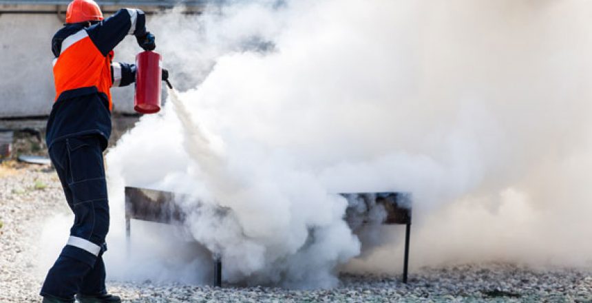 Woman putting out a training fire
