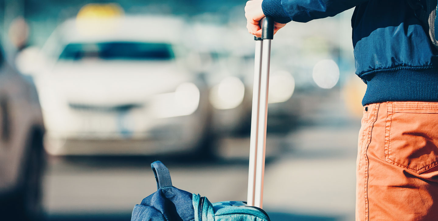 Traveler with suitcase in the airport